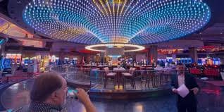 player 333 live dealer studio showing multiple blackjack and roulette tables with professional dealers